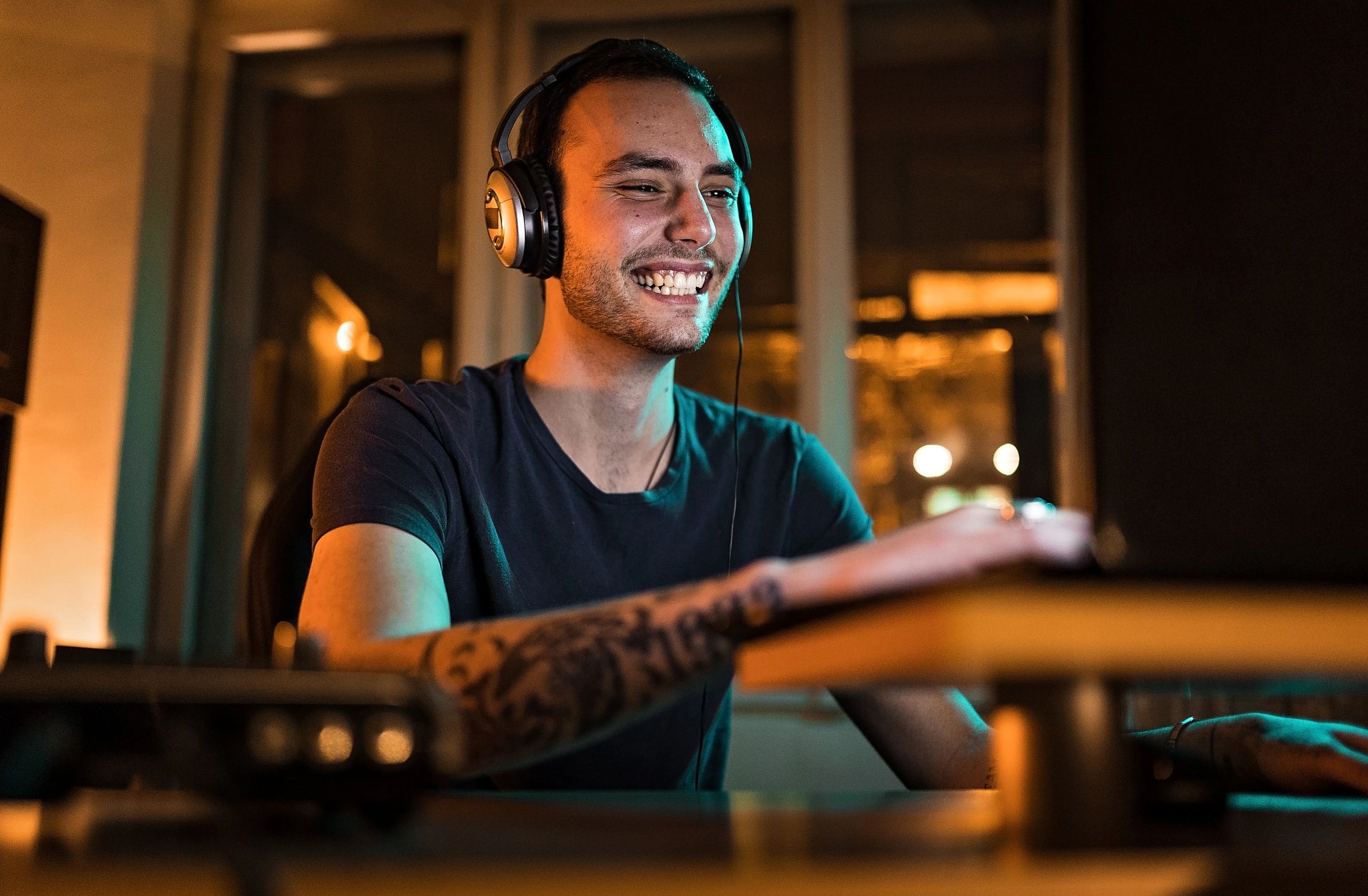 Content creator working in a home studio with audio equipment