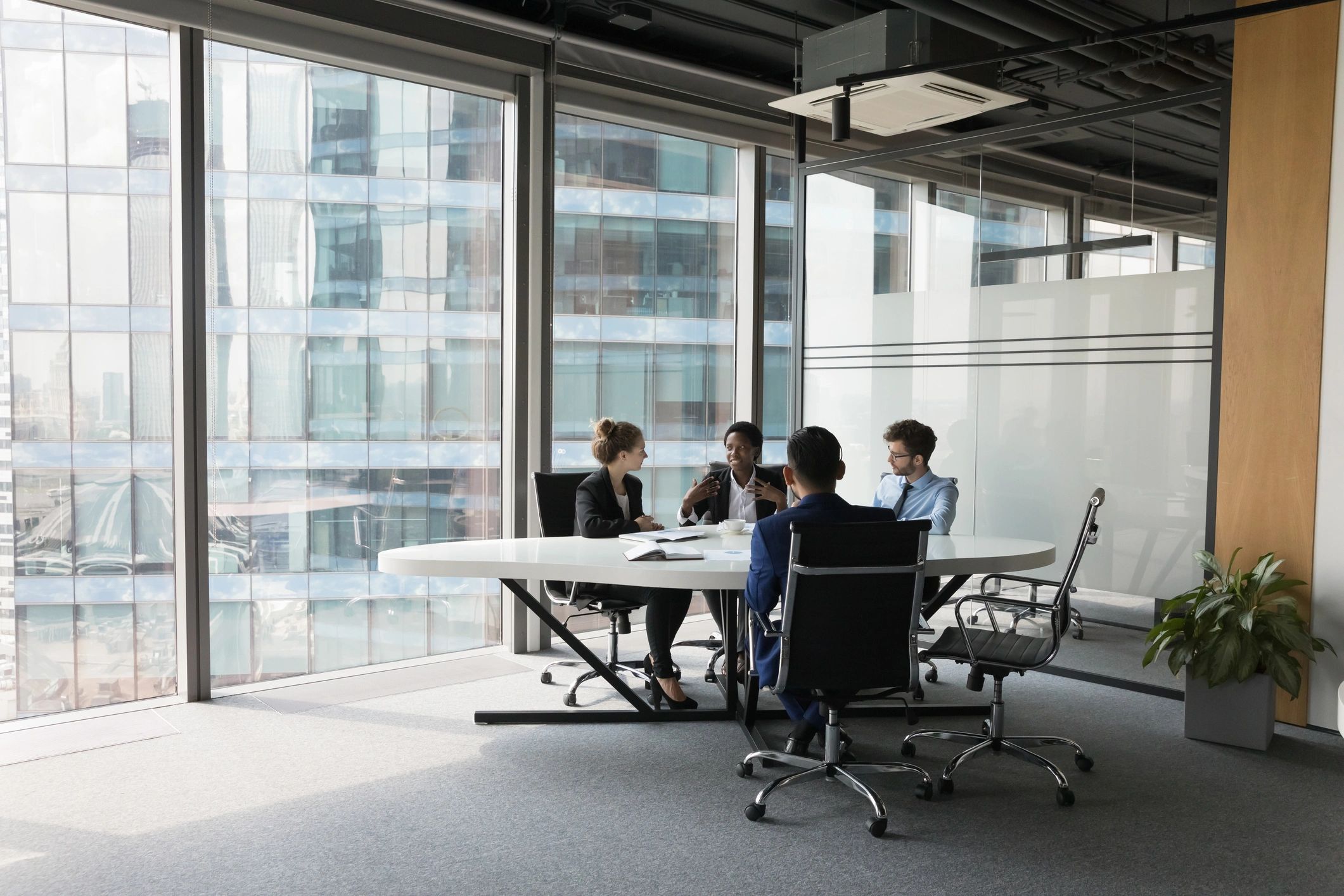Team members discussing ideas around a conference table