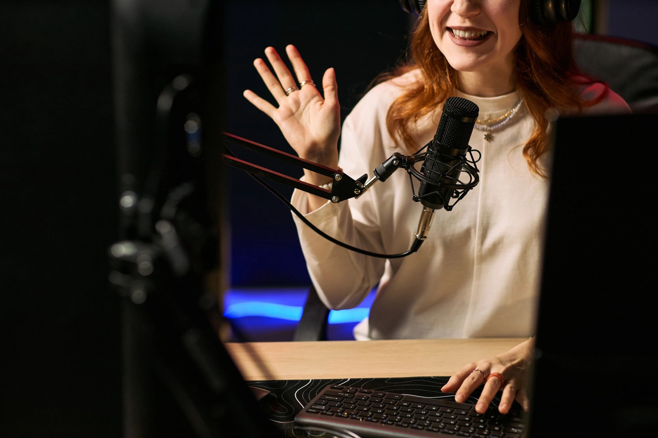 Smiling radio presenter in a studio